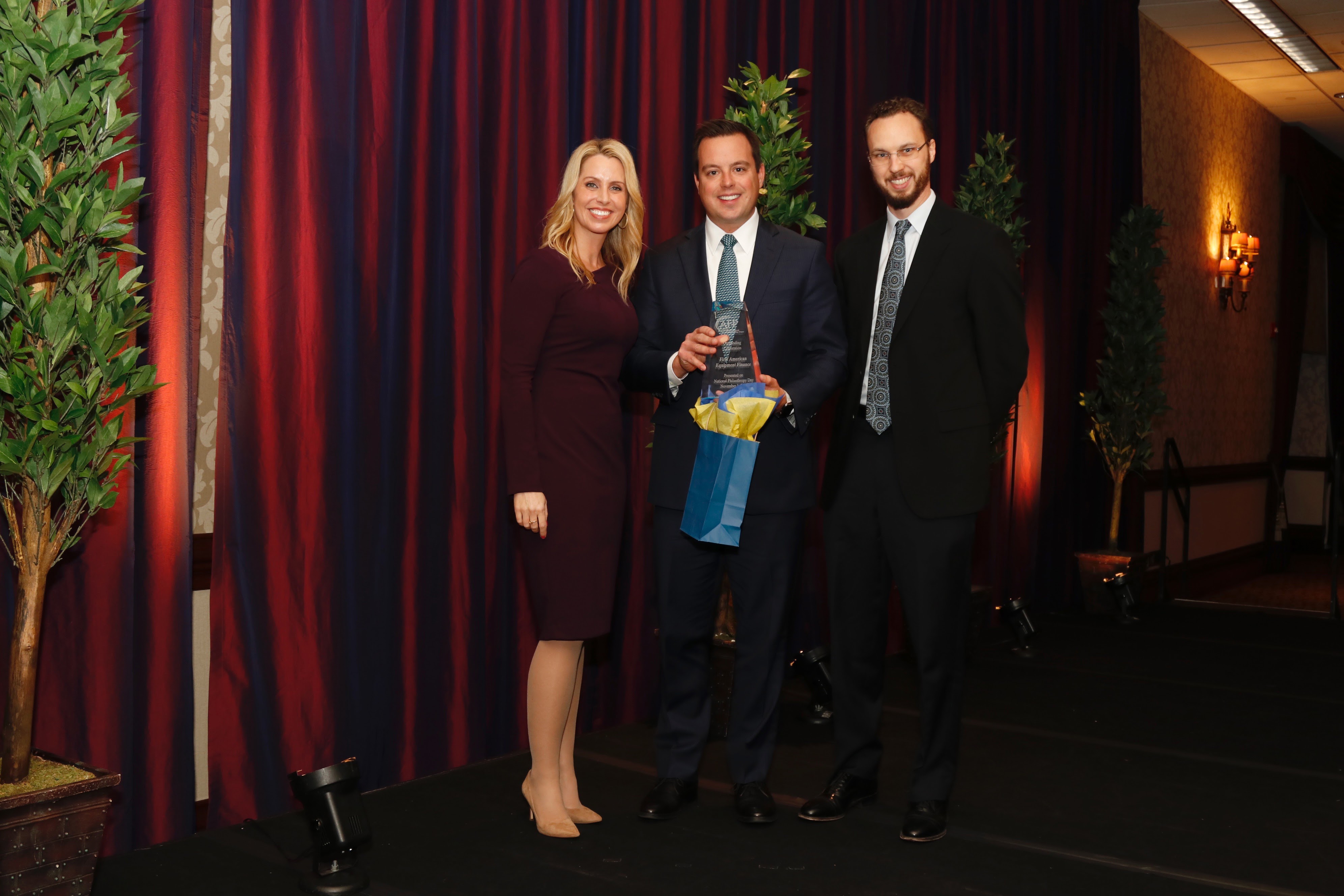 Jennifer Johnson, Emcee, 2019 AFPGV National Philanthropy Day Awards; Alan Sikora, CEO, First American Equipment Finance, Winner- 2019 Outstanding Corporation; Ben Jacobs, Editor, Rochester Business Journal