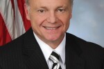 Man wearing a suit and striped tie